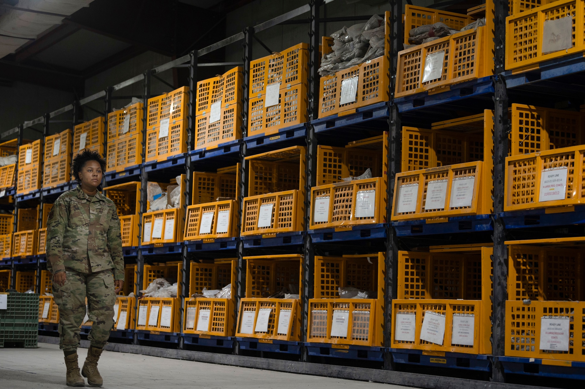 U.S. Air Force Staff Sgt. Iyana Milner, 386th Expeditionary Logistics Readiness Squadron Expeditionary Theater Distribution Center supervisor, inventories protective gear at the ETDC on Ali Al Salem Air Base, Kuwait, July 13, 2022. The EDTC team is responsible for the maintenance and readiness of approximately 200,000 pieces of equipment. (U.S. Air Force photo by Staff Sgt. Dalton Williams)