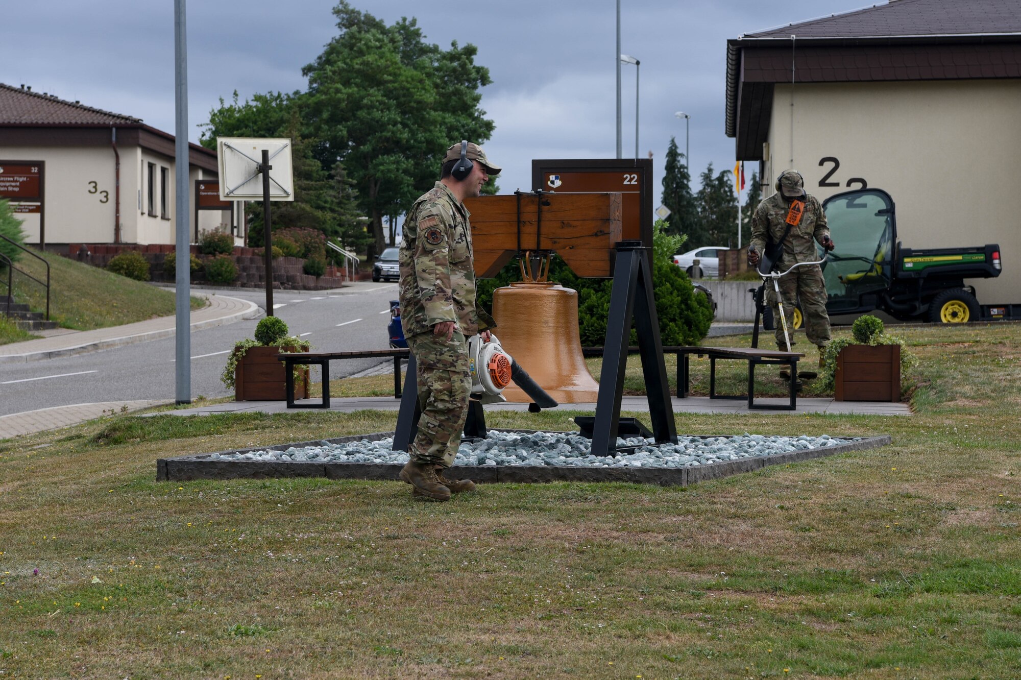 U.S. Air Force Airmen from the 52nd Maintenance Squadron clean up the area around the Spangdahlem Heritage Bell on
July 7, 2022, on Spangdahlem Air Base, Germany. The bell was a gift from the local community in July 1976 to celebrate the U.S. Bicentennial. (U.S. Air Force photo by Airman 1st Class Imani West)
