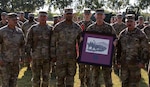 Brig. Gen. Andrew Preston, commandant of the United States Army Field Artillery School, presents the Alexander Hamilton Award to Capt. Zebadiah Wilson, commander of Battery B, 1st Battalion, 158th Field Artillery Regiment, 45th Field Artillery Brigade, July 16, 2022. The Alexander Hamilton Award is presented annually to the best field artillery unit in the National Guard.