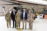 Left to right, U.S. Army Brig. Gen. Lawrence Schloegl, assistant adjutant general-Army, Latvian Ambassador Māris Selga, U.S. Army Maj. Gen. Paul Rogers, adjutant general and director, Michigan Department of Military and Veterans Affairs, Latvian Prime Minister Krišjānis Kariņš, and Defense Attaché Maj. Gen. Andis Dilāns tour the 3rd Battalion, 238th Aviation Regiment aircraft facility, Grand Ledge Armory, Michigan, July 1, 2022. For nearly 30 years, the Michigan National Guard and the National Armed Forces of Latvia have partnered under the Department of Defense National Guard Bureau State Partnership Program.