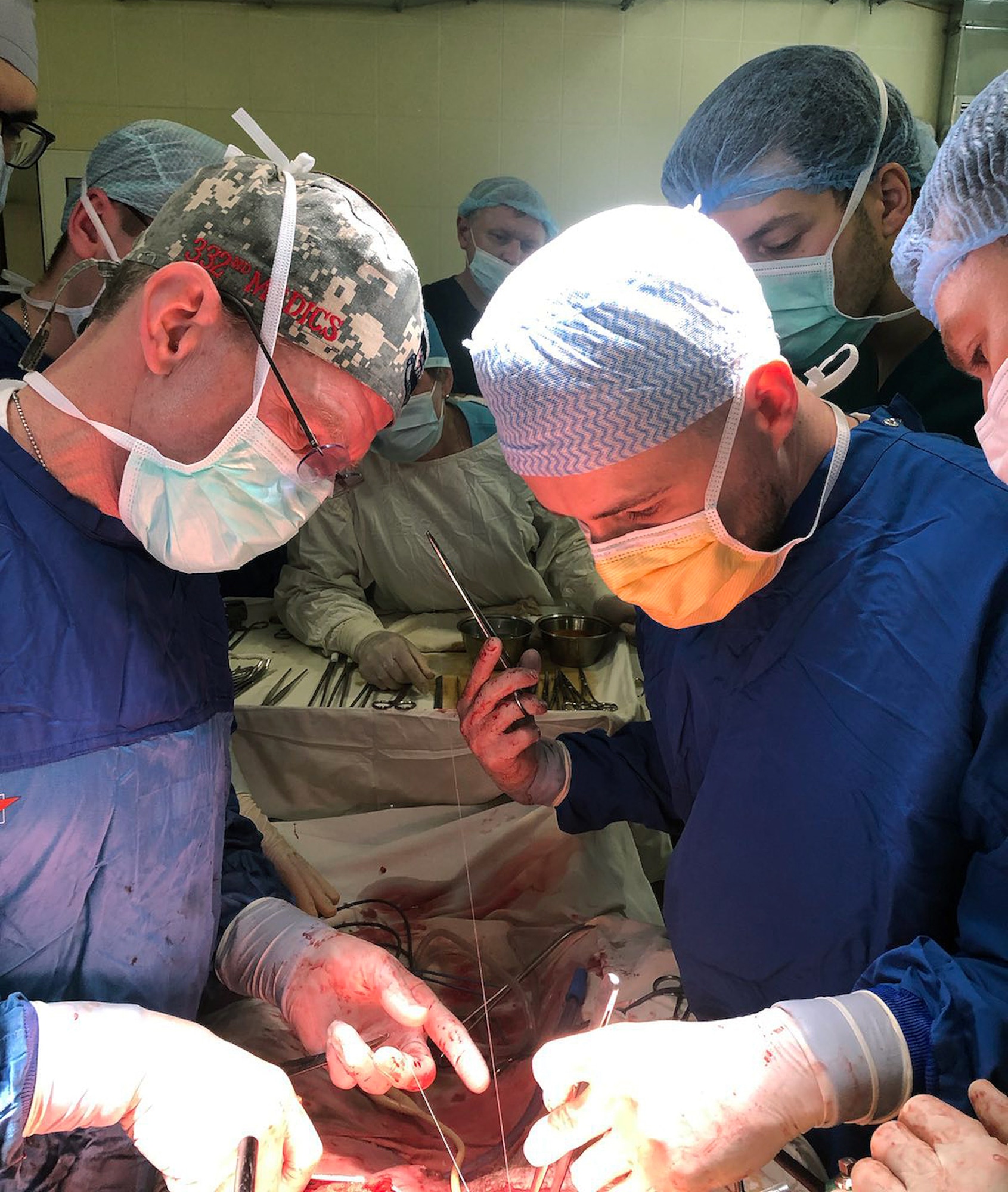 Image of Airmen performing surgery.