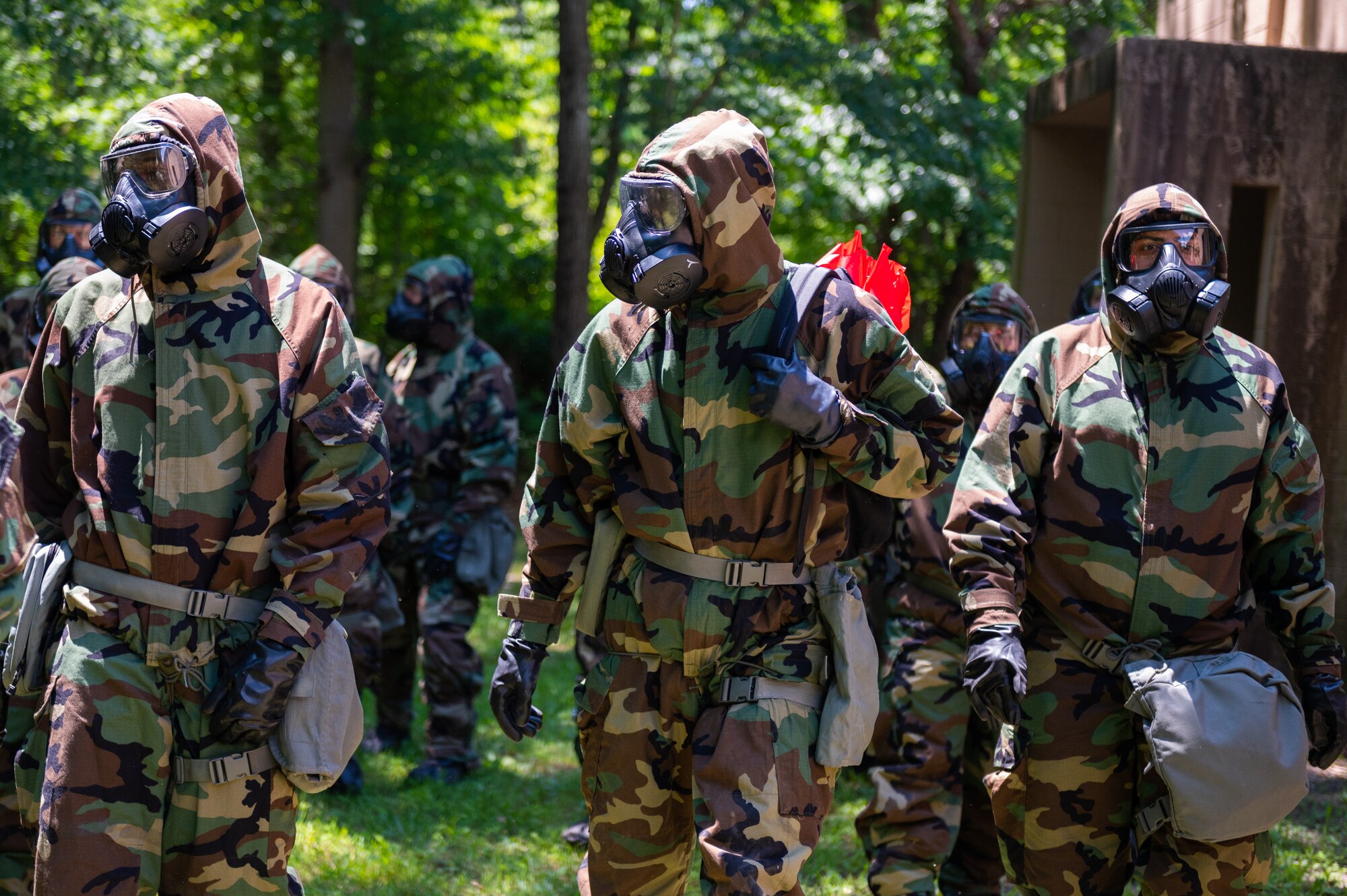 U.S. Air Force Airmen assigned to the 87th Civil Engineer Group search for simulated unexploded ordnance during an Ability to Survive and Operate exercise at Joint Base McGuire-Dix-Lakehurst, N.J., July 14, 2022. The exercise provided Airmen with in-depth instruction on basic survival and operational skills in a contested environment. (U.S. Air Force photo by Airman 1st Class Sergio Avalos)