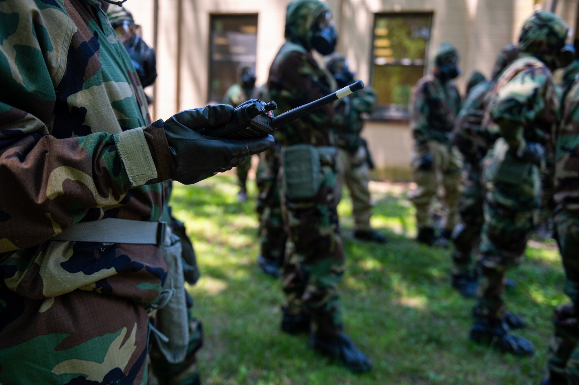 U.S. Air Force Airmen assigned to the 87th Civil Engineer Group search for simulated unexploded ordnance during an Ability to Survive and Operate exercise at Joint Base McGuire-Dix-Lakehurst, N.J., July 14, 2022. The exercise provided Airmen with in-depth instruction on basic survival and operational skills in a contested environment. (U.S. Air Force photo by Airman 1st Class Sergio Avalos)