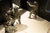 Soldiers clear a room