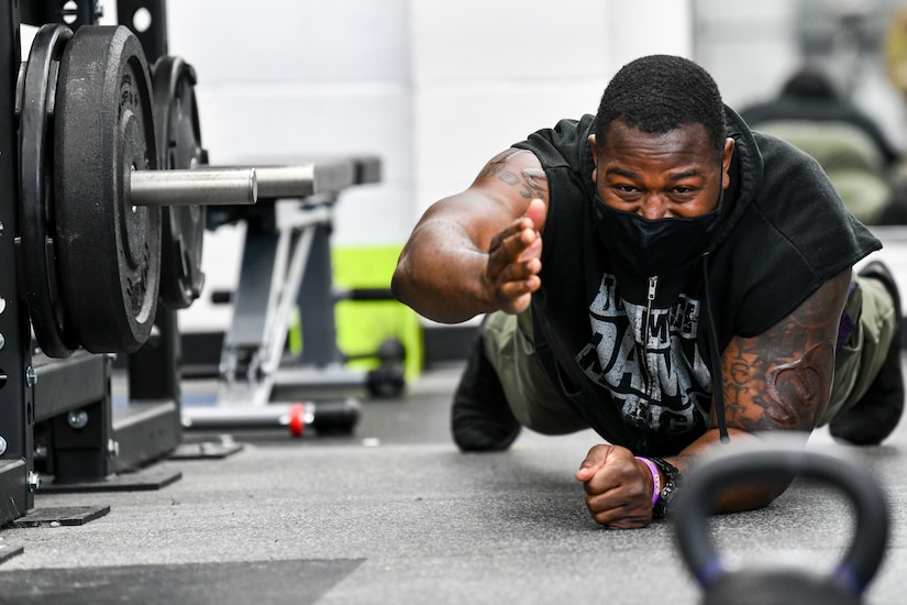 A man works out with weights.