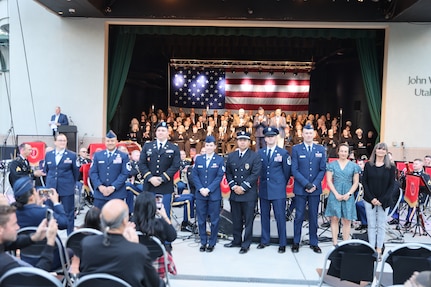 Military of the year awardees stand on stage to be recognized.