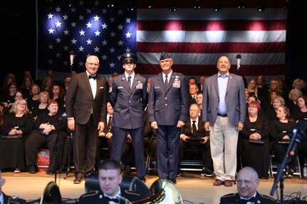 Award recipients are being recognized on a stage