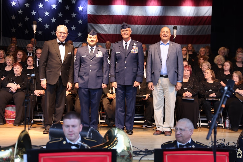 Award recipients are being recognized on a stage