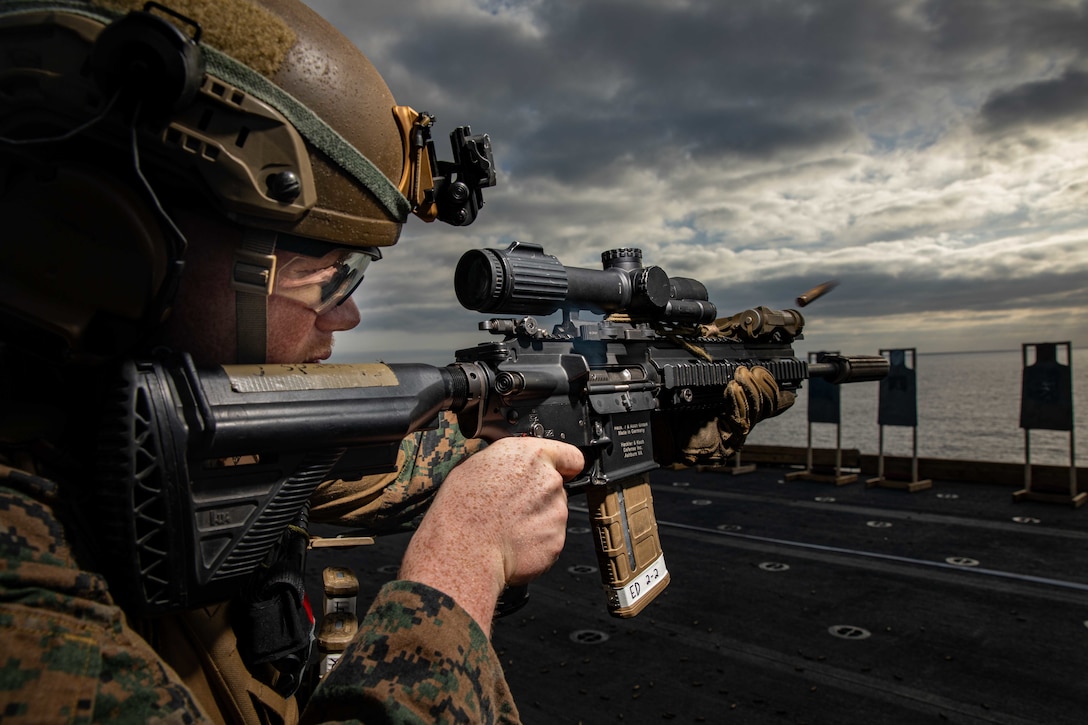U.S. Marine Corps Lance Cpl. Camron Edwards, a rifleman with Golf Company, Battalion Landing Team 2/6, 22nd Marine Expeditionary Unit, engages targets during a live-fire range aboard the Wasp-class amphibious assault ship USS Kearsarge (LHD 3) in the Atlantic Ocean, July 15, 2022. The Kearsarge Amphibious Ready Group and 22nd MEU, under the command and control of Task Force 61/2, is on a scheduled deployment in the U.S. Naval Forces Europe area of operations, employed by U.S. Sixth Fleet to defend U.S., allied and partner interests.