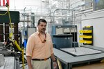 IMAGE: Senior Structural Dynamicist, Shawn Schneider is pictured in the Naval Surface Warfare Center Dahlgren Division Multiple Degree of Freedom (MDOF) shaker testing laboratory.