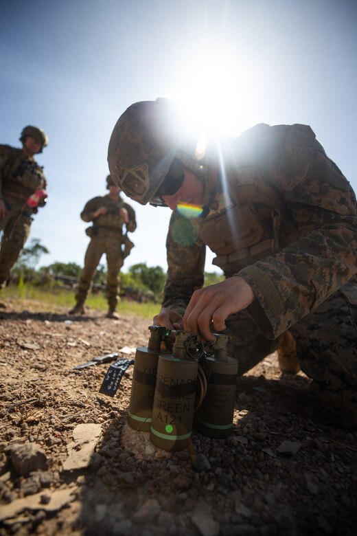 Marine prepares a charge to be detonated.