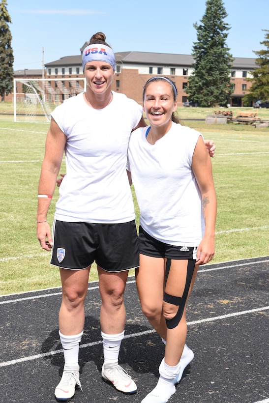 Soccer players pose for a photo
