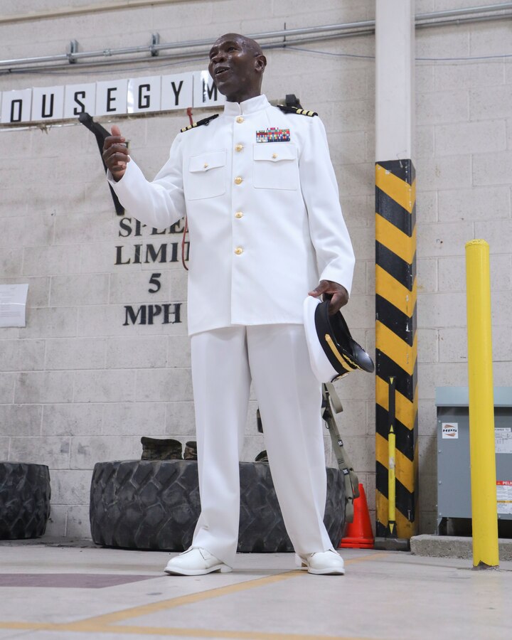 U.S. Navy Cmdr. Devon Foster, chaplain, Marine Aircraft Group 13 (MAG-13), 3rd Marine Aircraft Wing, speaks to the audience during his promotion ceremony at Marine Corps Air Station Yuma, Arizona, June 29, 2022.