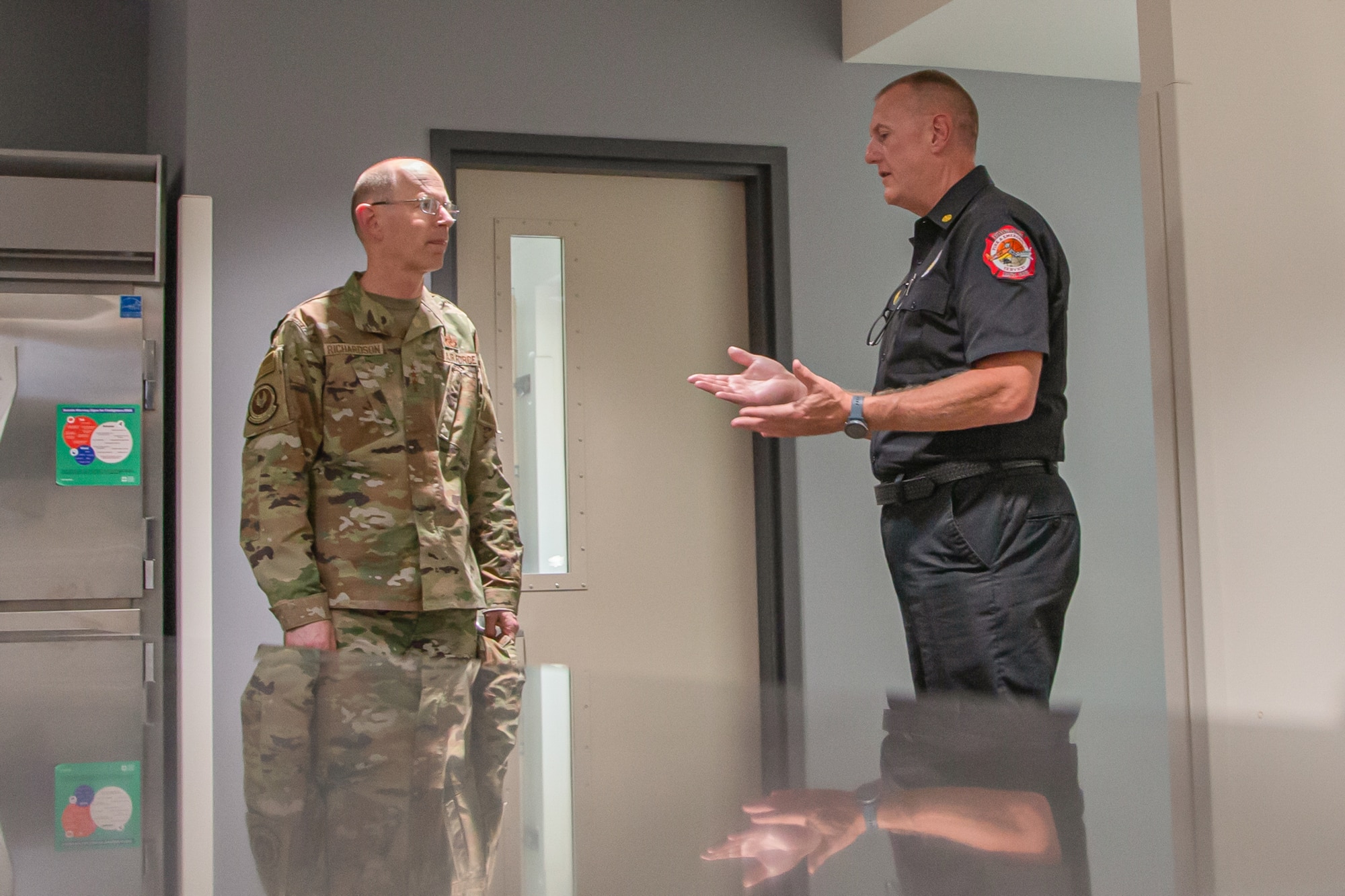 Fire and Emergency Services Chief Tim Johnson provides a tour to Gen. Duke Z. Richardson, Air Force Materiel Command commander, during his visit to Edwards Air Force Base, California, July 12. (U.S. Air Force photo by Todd Schannuth)