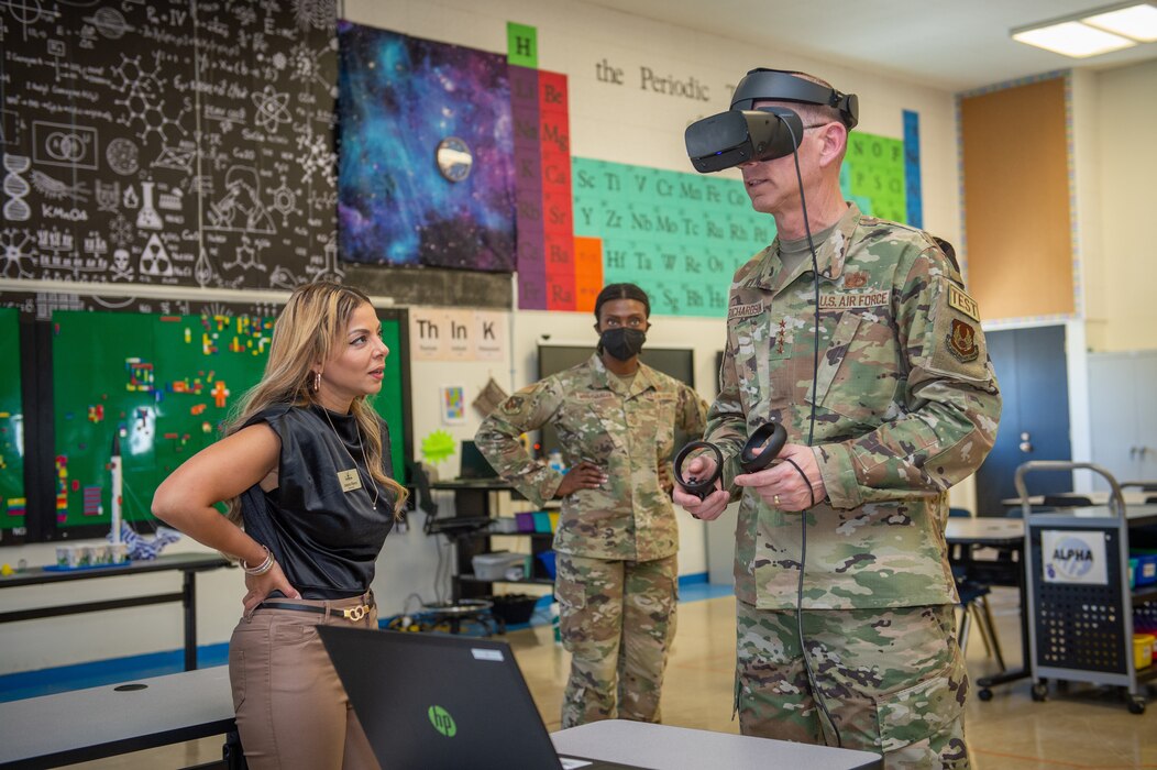 Gen. Duke Z. Richardson, Air Force Materiel Command commander, tests a virtual reality educational tool while Amira Flores, DoD STARBASE-Edwards director, provides instruction, on Edwards Air Force Base, California, July 13. DoD STARBASE is an educational program sponsored by the Office of the Assistant Secretary of Defense for Reserve Affairs. Students can participate in challenging "hands-on, mind-on" activities in aviation, science, technology, engineering, math, and space exploration. (U.S. Air Force photo by James West)