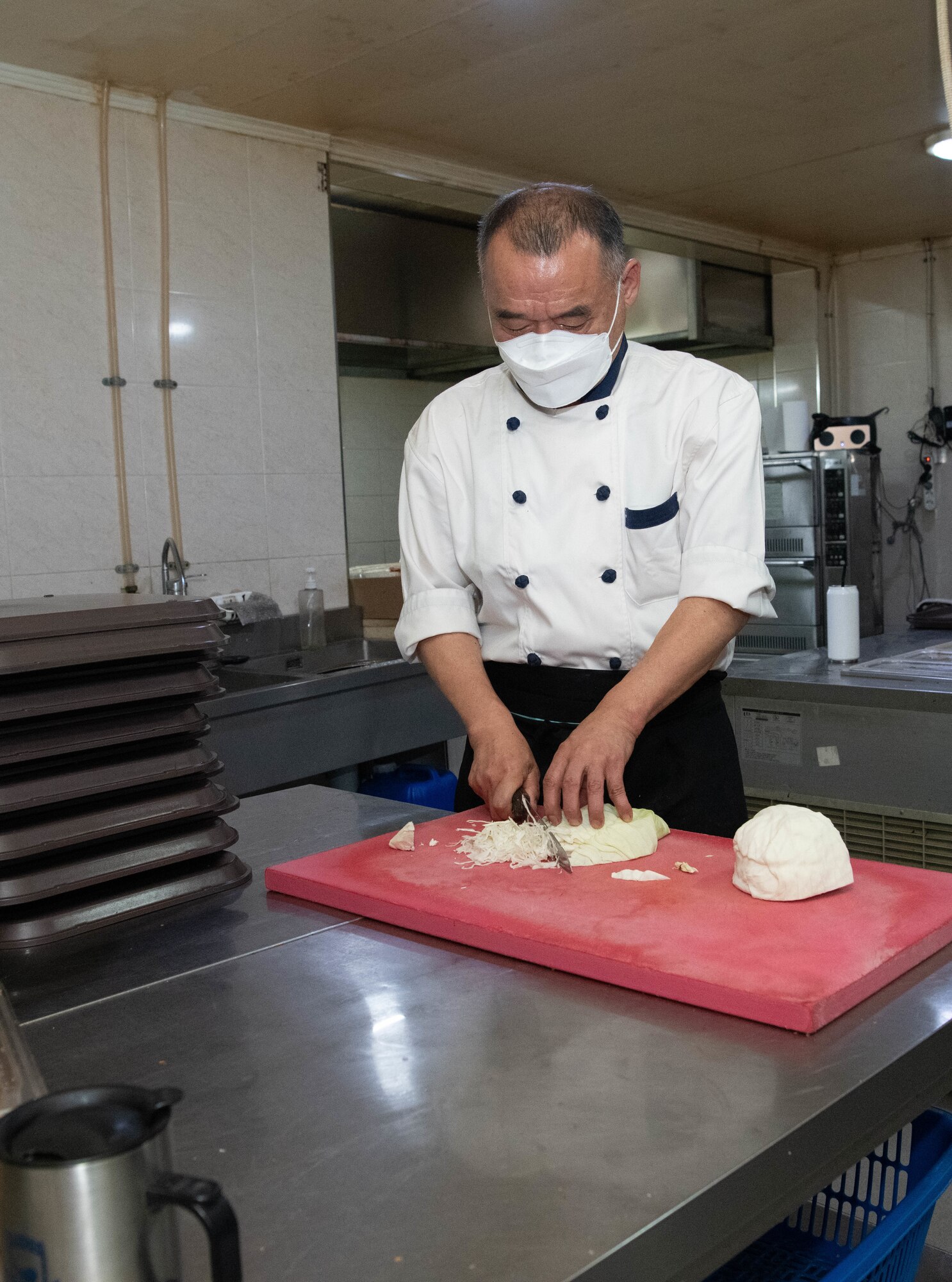 Jong Sik, Gun Sung Maru owner, prepares cabbage at Kunsan Air Base, Republic of Korea, July 8, 2022. Gun Sung Maru was operational for five years on the installation, feeding and introducing Korean cuisine to many service members. (U.S. Air Force photo by Staff. Sgt. Sadie Colbert)