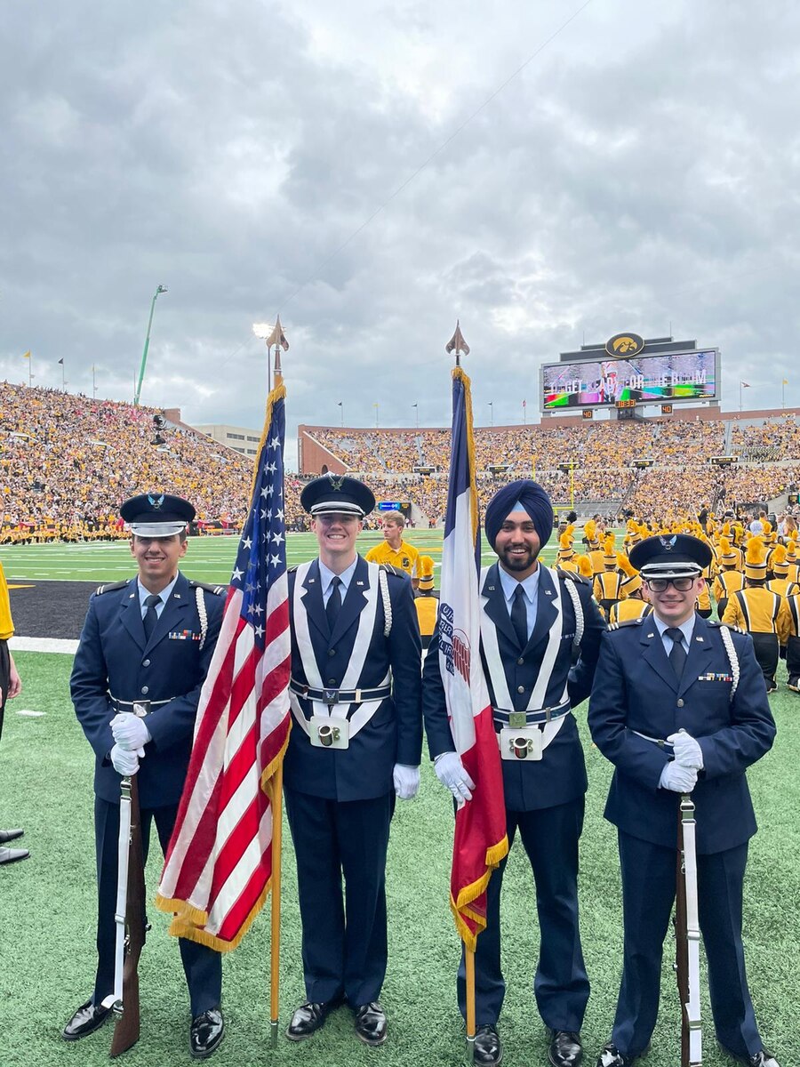 Air Force ROTC Cadet Gursharan Virk, third from left, takes part in Detachment 255’s color guard ceremony at a football game at the University of Iowa in 2021. Virk is the first Sikh ROTC cadet to be granted religious accommodations by the Air Force in observation of his faith. The accommodations include wear of a turban and facial hair. (Courtesy photo)