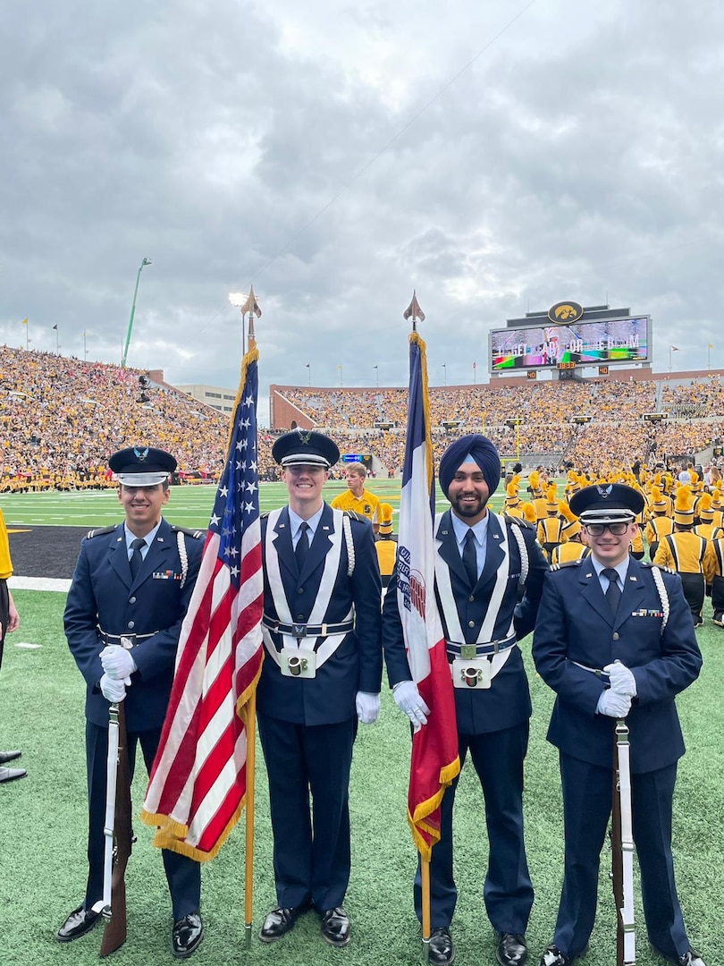 Air Force ROTC Cadet Gursharan Virk, third from left, takes part in Detachment 255’s color guard ceremony at a football game at the University of Iowa in 2021. Virk is the first Sikh ROTC cadet to be granted religious accommodations by the Air Force in observation of his faith. The accommodations include wear of a turban and facial hair. (Courtesy photo)
