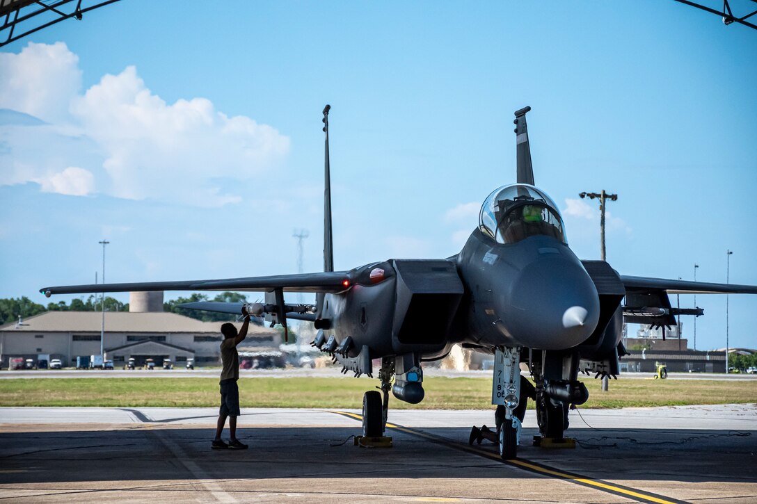 A maintenance support contractor checks the AIM-120D3 attached to an F-15E Strike Eagle as it prepares for a live-fire mission at Eglin Air Force Base, Fla., June 30, 2022. In the months preceding the live-fire execution, the Integrated Test team conducted several captive carry test missions with AIM-120D Instrumented Test Vehicles to collect data and ensure the new missile hardware and software would function correctly on the day of the live-fire. (U.S. Air Force photo by 1st Lindsey Heflin)