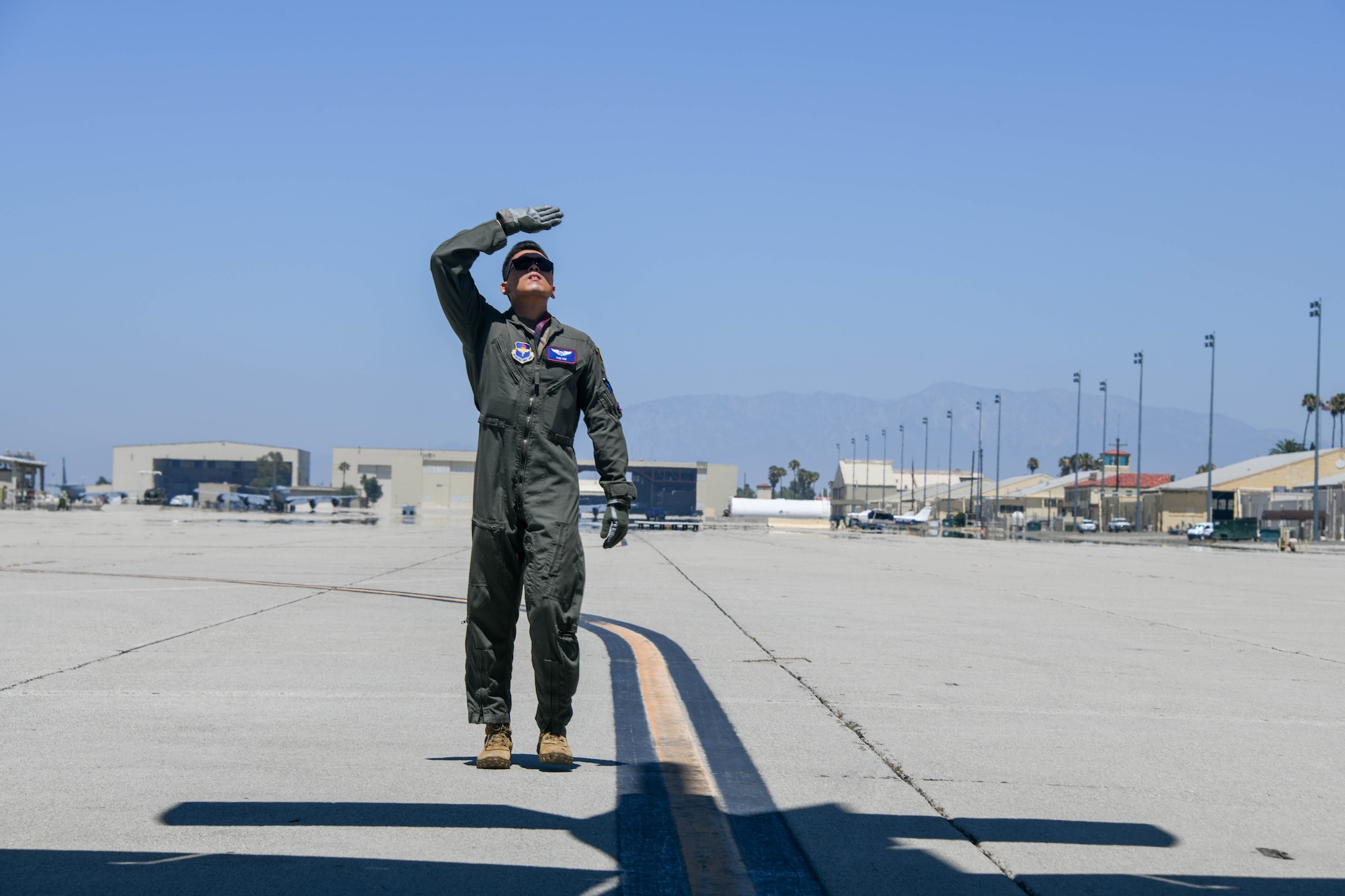 U.S. Air Force Capt. Tae Kim, an instructor pilot from the 54th Air Refueling Squadron (ARS) at Altus Air Force Base (AFB), Oklahoma, performs a preflight check of a KC-135 Stratotanker at March Air Reserve Base, California, July 12, 2022. Airmen from the 54th ARS performed air refueling training with F-16 Fighter Falcons from the 310th Fighter Squadron at Luke AFB, Arizona. (U.S. Air Force photo by Airman 1st Class Trenton Jancze)