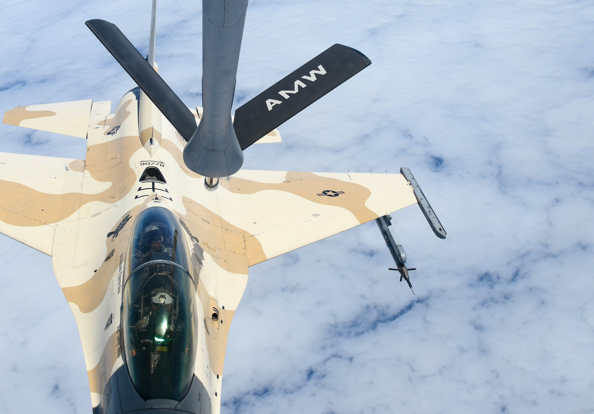 A U.S. Air Force F-16 Fighting Falcon from the 310th Fighter Squadron at Luke Air Force Base (AFB), Arizona, prepares to take fuel from a KC-135 Stratotanker, The KC-135 aircrew from the 54th Air Refueling Squadron at Altus AFB refueled more than 15 F-16s. (U.S. Air Force photo by Airman 1st Class Trenton Jancze)