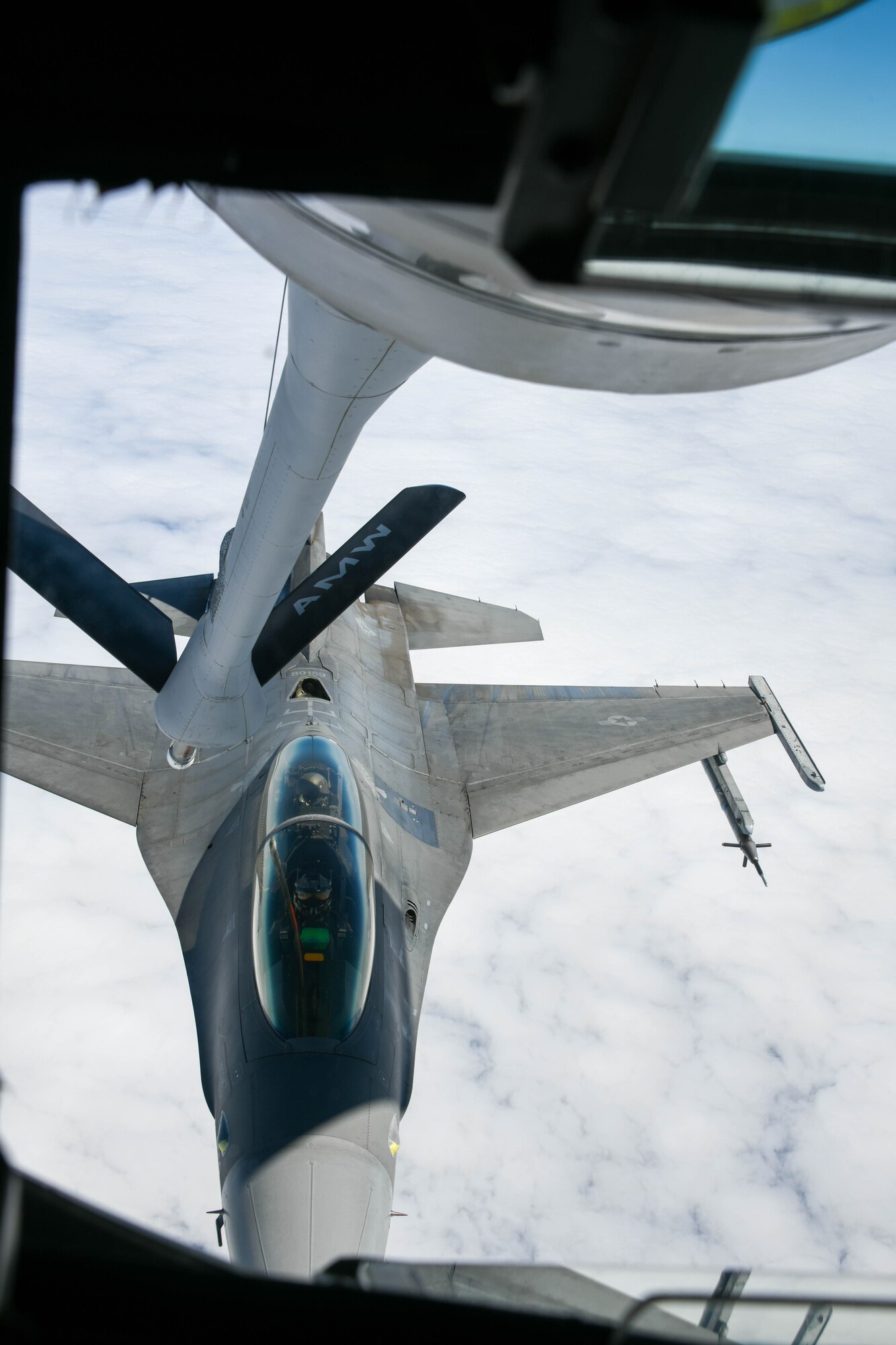 An F-16 Fighting Falcon from the 310th Fighter Squadron at Luke Air Force Base, Arizona, prepares to take fuel from a KC-135 Stratotanker, July 15, 2022. The KC-135 crew made 31 contacts and provided over 39,000 thousand pounds of fuel during their mission. (U.S. Air Force photo by Airman 1st Class Trenton Jancze)