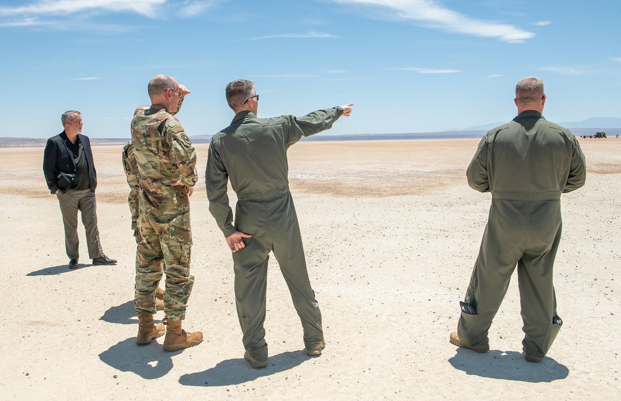 Col. Grant Mizell, 412th Operations Group commander, highlights a test sortie flown by the Emerging Technology Combined Test Force to Gen. Duke Z. Richardson, Air Force Materiel Command commander, on Rogers Dry Lake Bed on Edwards Air Force Base, California, July 13. Richardson learned about the various CTFs within the 412th Test Wing and their missions during his first visit to Edwards AFB. (U.S. Air Force photo by James West)