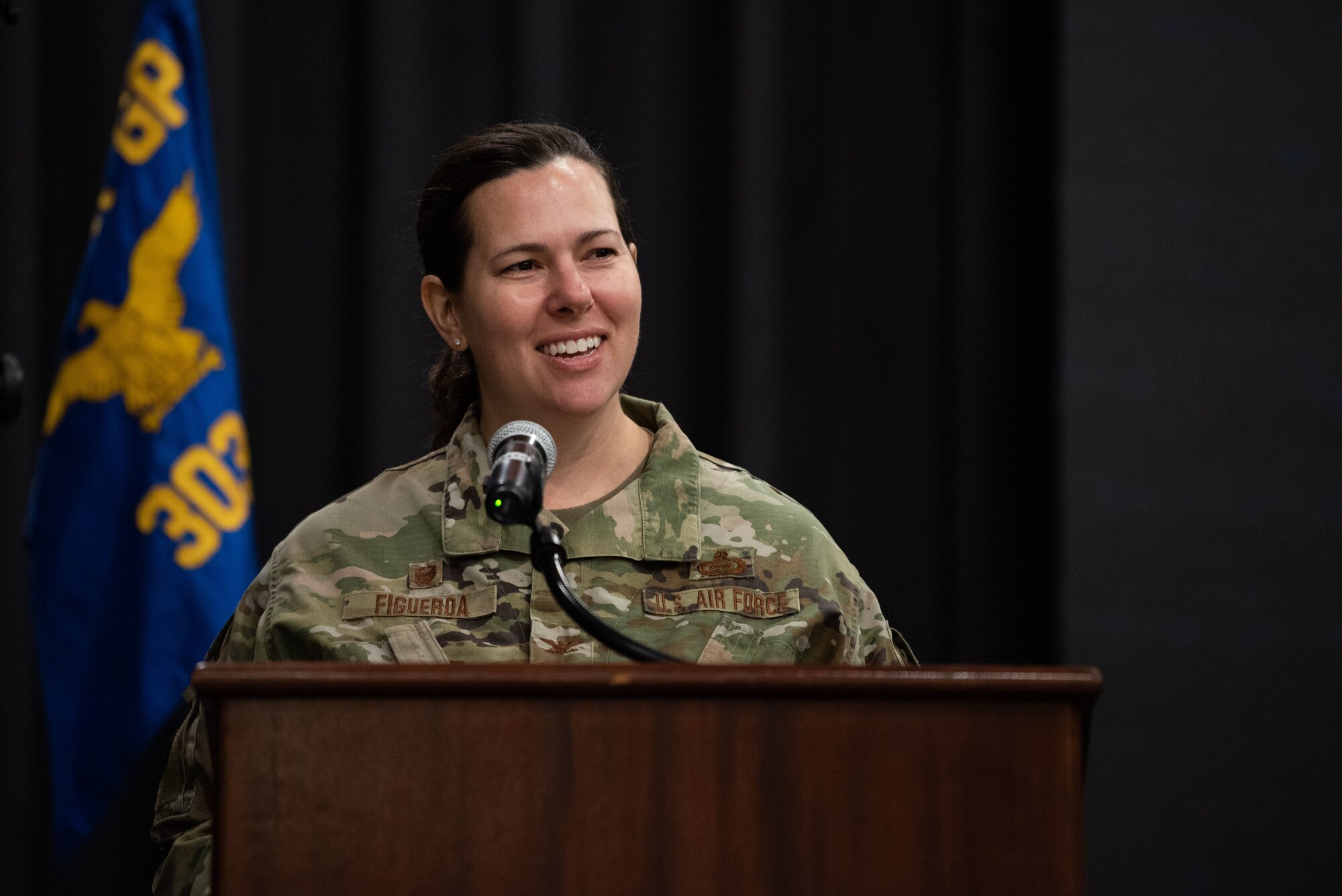 Col. Amanda Figueroa, 694th Intelligence, Surveillance and Reconnaissance Group commander, delivers opening remarks at the 303rd Intelligence Squadron assumption of command ceremony at Osan Air Base, Republic of Korea, July 18, 2022.