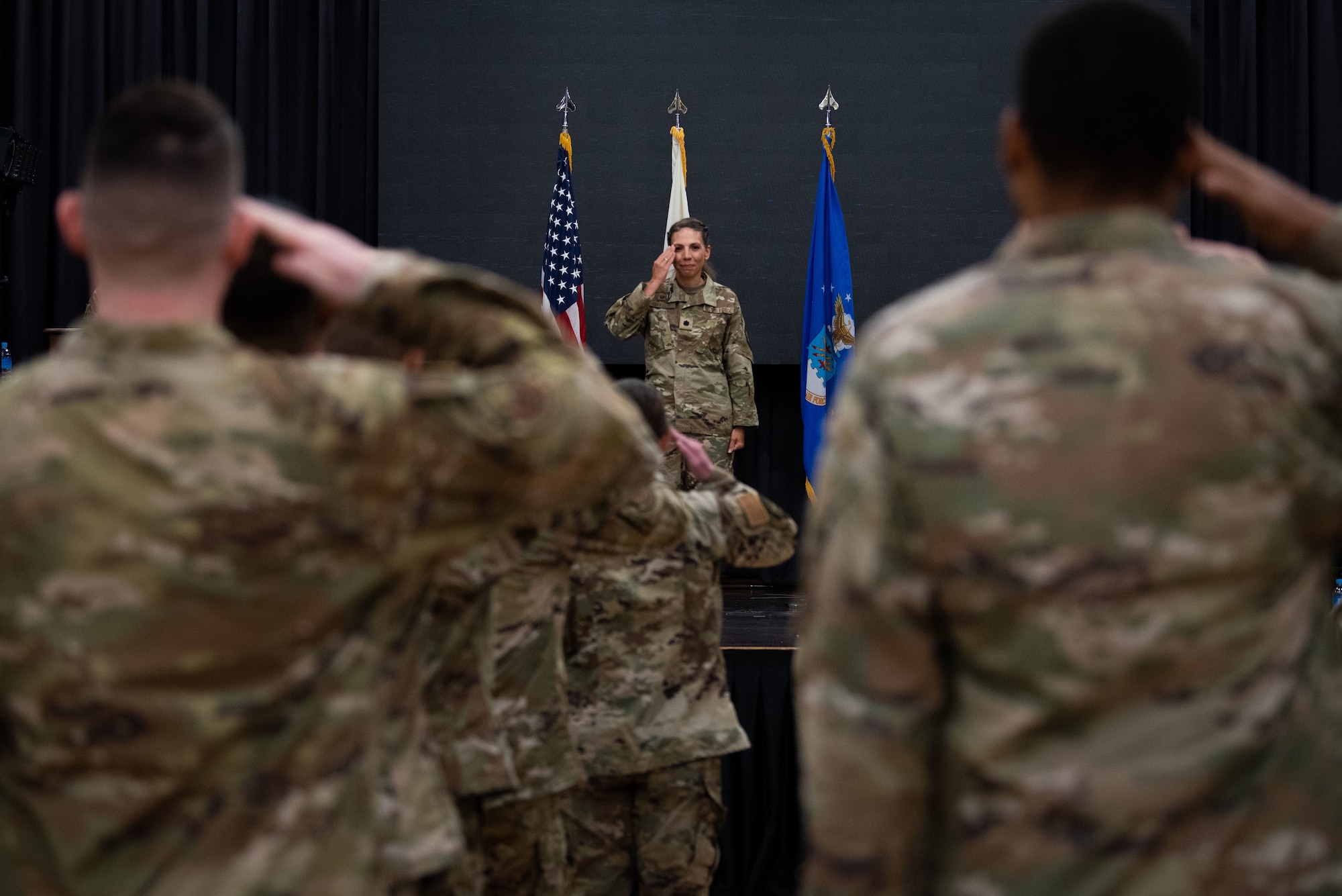 Lt. Col. Megan Davis, 303rd Intelligence Squadron incoming commander, receives her first salute as commander during the 303rd IS assumption of command ceremony at Osan Air Base, Republic of Korea, July 18, 2022.