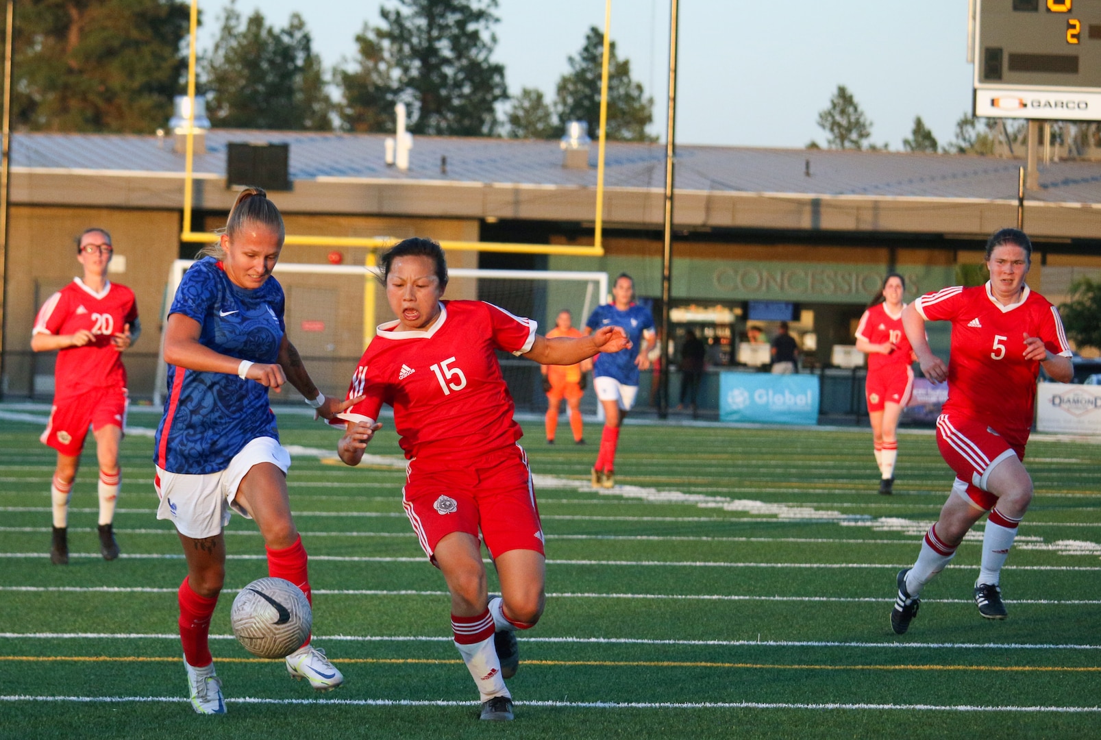 Canada's Katherine Fung defends against France's Fany Proniez in match 16 of the 13th Conseil International du Sport Militaire (CISM) World Women's Military Football Championship hosted by Fairchild Air Force Base in Spokane, Washingon.  This year's championship features teams from the United States, Belgium, Cameroon, Canada, France, Germany, Ireland, Mali, Netherlands, and South Korea.  (Department of Defense Photo by Mr. Steven Dinote, released).