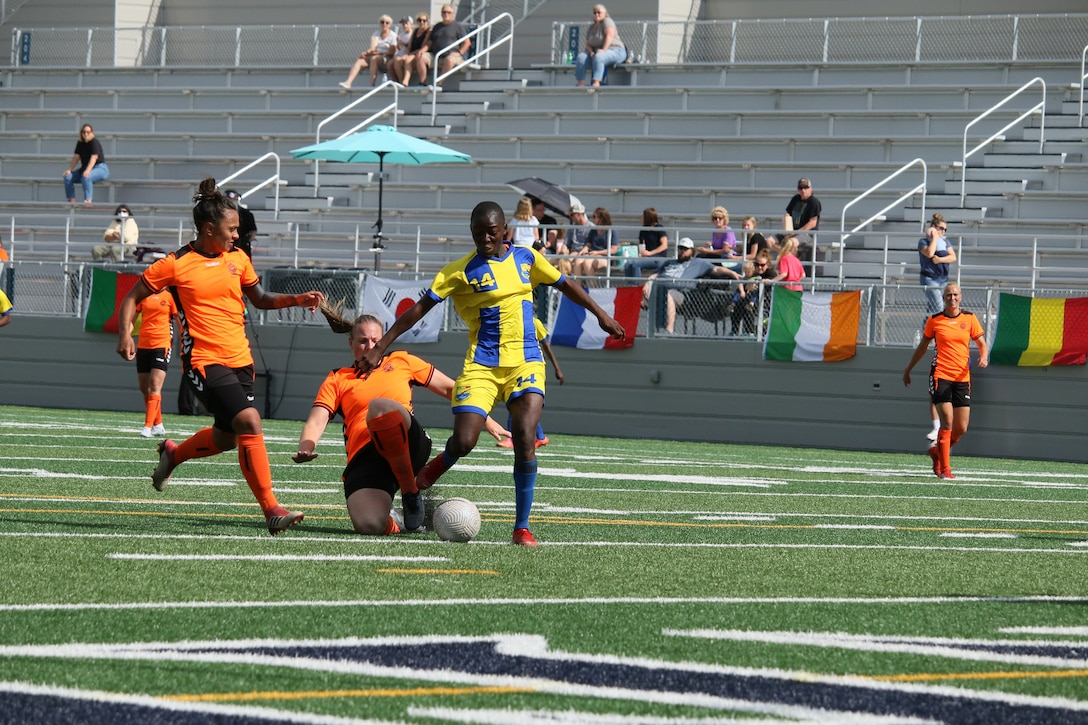 Mali's Oumou Kone drives through to score in match 15 with Mali v Netherlands at the 13th Conseil International du Sport Militaire (CISM) World Women's Military Football Championship hosted by Fairchild Air Force Base in Spokane, Washingon.  This year's championship features teams from the United States, Belgium, Cameroon, Canada, France, Germany, Ireland, Mali, Netherlands, and South Korea.  (Department of Defense Photo by Mr. Steven Dinote, released).