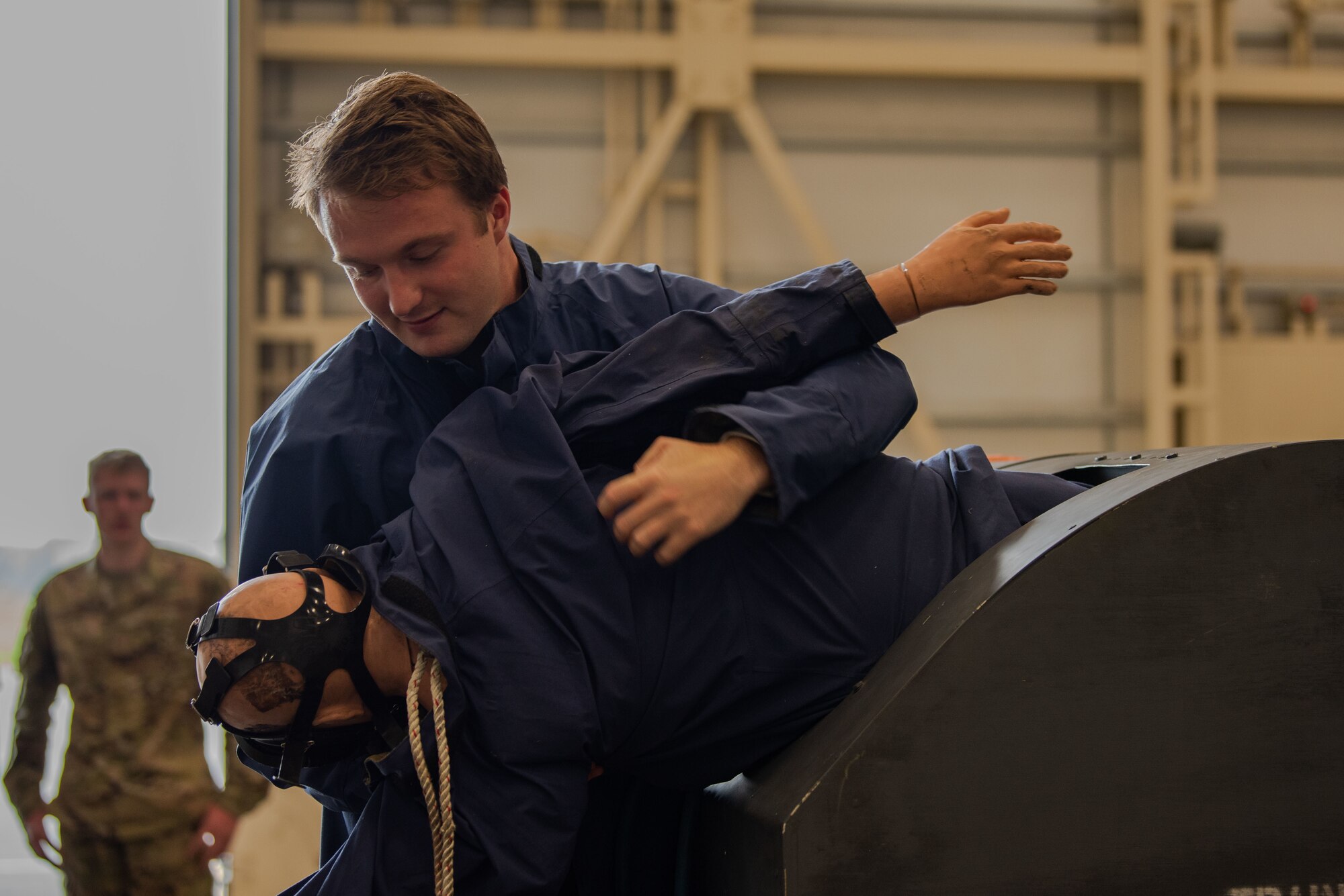 People in uniform work on an aircraft