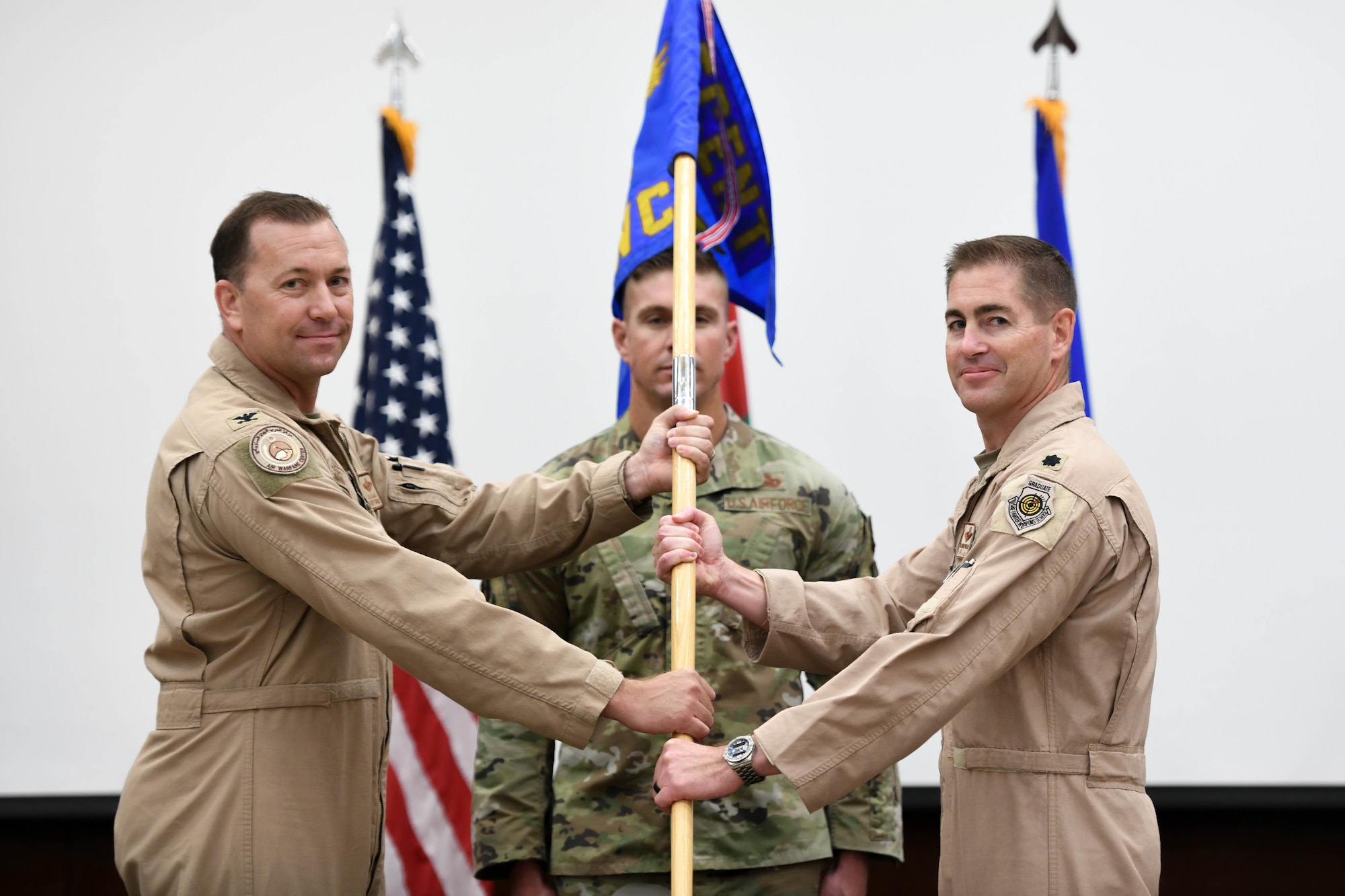 The Ninth Air Force (Air Forces Central) Air Warfare Center held a change of command ceremony July 15, 2022, at Erth Hotel, Abu Dhabi, United Arab Emirates. Col. Jordan G. Grant, the previous commander of AFCENT AWC passed the guidon to Lt. Col Kevin Walsh.