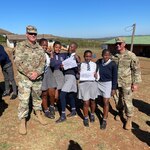 Lt. Col. Joseph Conley and Staff. Sgt. David Bailey stand with students from the Khanyiselisizwe High School for Nelson Mandela International Day July 18, 2022. The U.S. Soldiers are there for Shared Accord, a biannual training event to enhance operational skills and the partnership between the United States and South Africa.