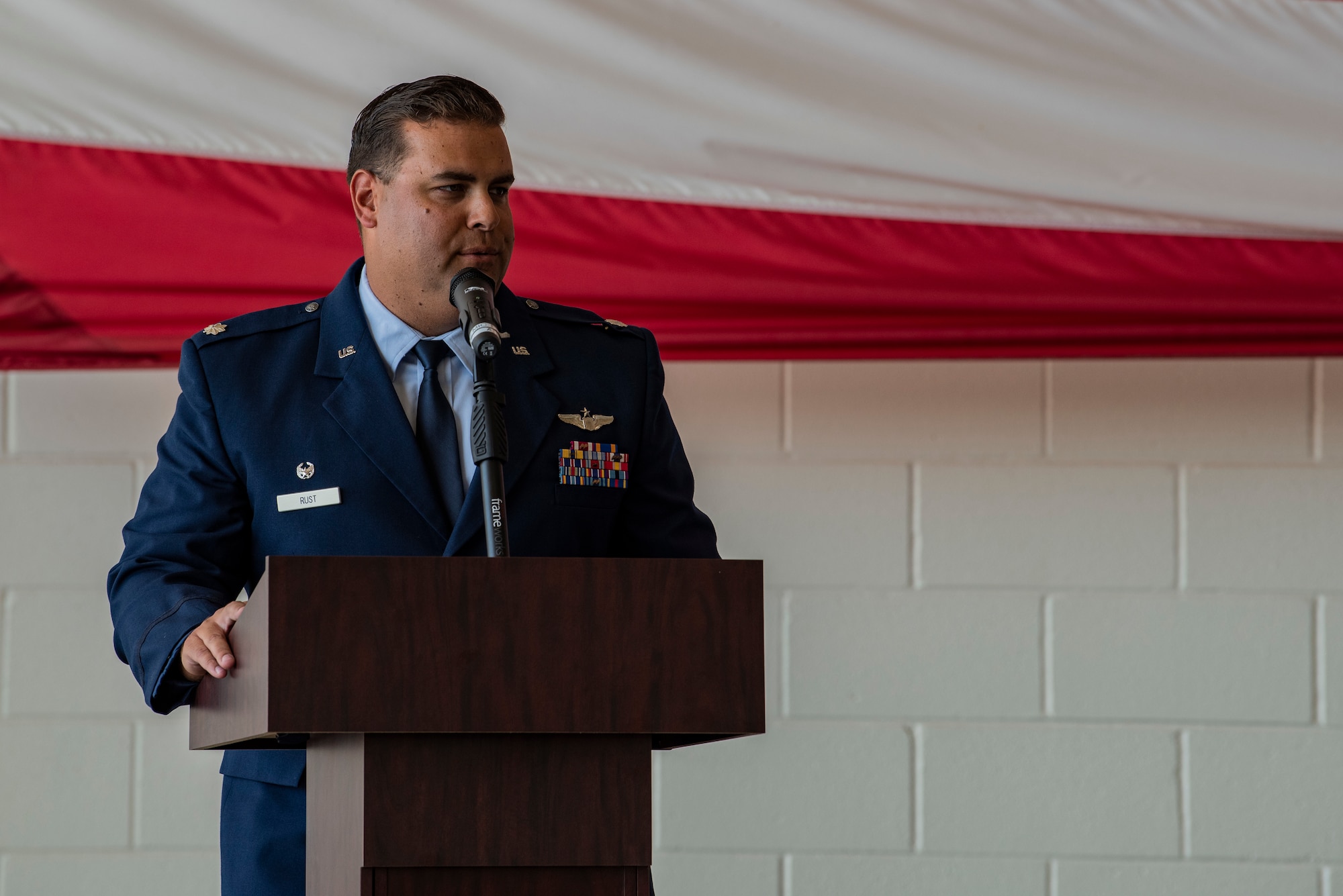 Lt. Col. Austin Rust, 317th Operations Support Squadron commander, delivers remarks after assuming command of the squadron during the 317th OSS change of command ceremony at Dyess Air Force Base, Texas, June 30, 2022. Rust arrived at Dyess in March of 2021 as the director of operations for the 40th Airlift Squadron before assuming command of the 317th OSS. (U.S. Air Force photo by Airman 1st Class Ryan Hayman)