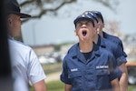 oast Guard boot camp recruits shout a response to their company commander at Coast Guard Training Center Cape May, New Jersey, May 18, 2022. (U.S. Coast Guard photo by Petty Officer 1st Class Lisa Ferdinando)