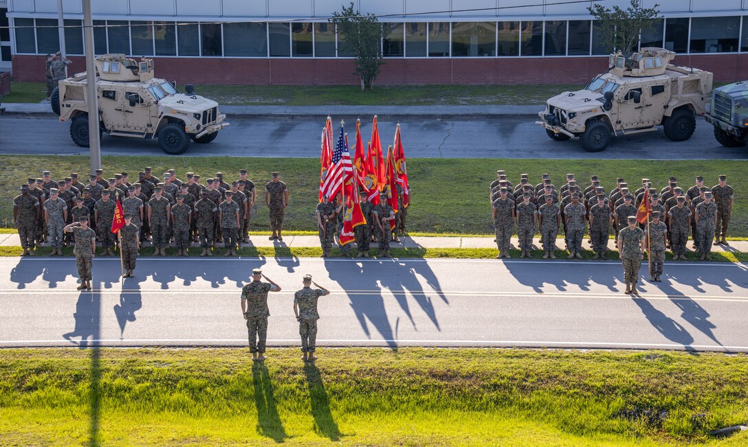 U.S. Marine Corps Sgt. Maj. Christopher Denham and Col. Michael McCarthy, Marine Air Control Group 28 sergeant major and commanding officer, salute during a realignment ceremony at Marine Corps Air Station Cherry Point, North Carolina, June 1, 2022. This event saw the reassignment of Marine Wing Support Squadron 271, previously assigned to Marine Aircraft Group 14, to the command of MACG-28. This change took place in alignment with Force Design 2030, an effort to redesign the Marine Corps to better fulfill its role as the nation's naval expeditionary force-in-readiness. (U.S. Marine Corps photo by Lance Cpl. Jacob Bertram)