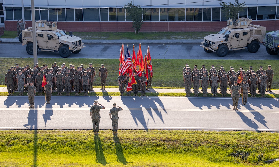 U.S. Marine Corps Sgt. Maj. Christopher Denham and Col. Michael McCarthy, Marine Air Control Group 28 sergeant major and commanding officer, salute during a realignment ceremony at Marine Corps Air Station Cherry Point, North Carolina, June 1, 2022. This event saw the reassignment of Marine Wing Support Squadron 271, previously assigned to Marine Aircraft Group 14, to the command of MACG-28. This change took place in alignment with Force Design 2030, an effort to redesign the Marine Corps to better fulfill its role as the nation's naval expeditionary force-in-readiness. (U.S. Marine Corps photo by Lance Cpl. Jacob Bertram)