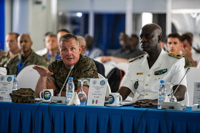 (Left) U.S. Marine Corps Maj. Gen. Tracy W. King, commander of U.S. Marine Corps Forces Europe and Africa and (Right) Senegalese Naval Chief of Staff Rear Adm. Oumar Wade speak with African military partners during the Naval Infantry Leadership Symposium - Africa 2022 in Dakar, Senegal, July 6, 2022. NILS -A is a multinational, Africa-focused forum, designed to bring together partner nations with marine forces and naval infantries to develop interoperability, crisis response capabilities, and foster relationships which will improve Africa’s maritime domain security.