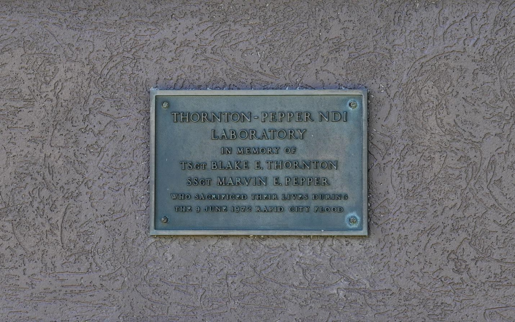The dedication plaque of the 28th Maintenance Squadron Fabrication Flight Non-Destructive Inspection lab at Ellsworth Air Force Base, S.D., July 13, 2022.