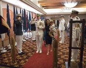 U.S. Navy Cmdr. Gareth Montgomery, center, outgoing director of Installation and Logistics (I&L), Marine Corps Air Station Yuma, Arizona, returns a salute during his retirement ceremony aboard the installation, July 11, 2022. Montgomery directed I&L for two years and retired after 22 years of service. (U.S. Marine Corps photo by Lance Cpl. Jade Venegas)