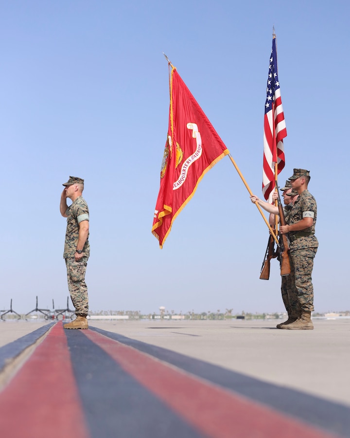 U.S. Marine Corps Lt. Col. Robert Reinoehl, left, outgoing commanding officer, Headquarters and Headquarters Squadron (H&HS), Marine Corps Air Station (MCAS) Yuma, Arizona, renders a salute during a change of command ceremony aboard the installation, June 30, 2022.