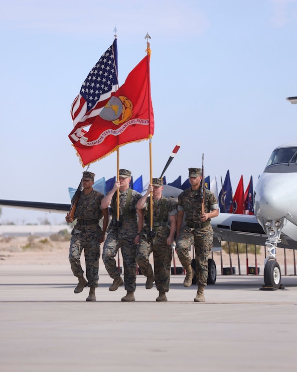 U.S. Marines with the Headquarters and Headquarters Squadron (H&HS) color guard execute a drill movement during a change of command ceremony at Marine Corps Air Station (MCAS) Yuma, Arizona, June 30, 2022. Lt. Col. Robert Reinoehl commanded H&HS for two years and relinquished command to Lt. Col. Michael Hayes, previously the MCAS Yuma operations officer. (U.S. Marine Corps photo by Lance Cpl. Jade Venegas)