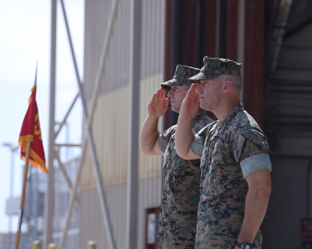 U.S. Marines Lt. Col. Michael Hayes, far, oncoming commanding officer, and Lt. Col. Robert Reinoehl, near, outgoing commanding officer, Headquarters and Headquarters Squadron (H&HS), Marine Corps Air Station (MCAS) Yuma, Arizona, render a salute during a change of command ceremony aboard the installation, June 30, 2022. Reinoehl commanded H&HS for two years and relinquished command to Hayes, previously the MCAS Yuma operations officer. (U.S. Marine Corps photo by Lance Cpl. Jade Venegas)