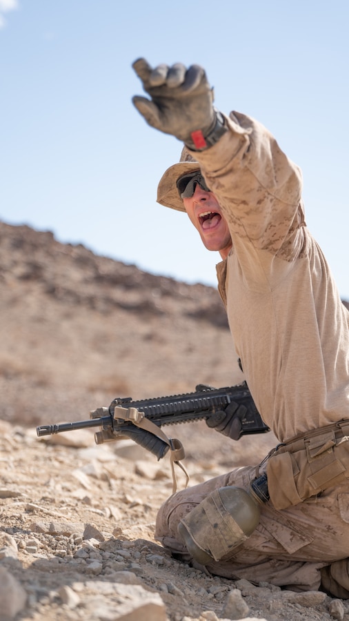 U.S. Marine Corps Lance Cpl. Alan Satterlee, a rifleman attached to India Company, 3rd Battalion, 23rd Marine Regiment, from Athens, Al., directs members of his fireteam at Range 400, Marine Corps Air-Ground Combat Center, Twentynine Palms, Calif., during Integrated Training Exercise 4-22, on July 18, 2022. Reserve Marines and Sailors have come together from across the nation to form an integrated Marine Air-Ground Task Force to take part in a live-fire, combined arms exercise that will better prepare Marine Forces Reserve in its mission to augment and reinforce the Active Component. (U.S. Marine Corps Photo by Cpl. James Stanfield)