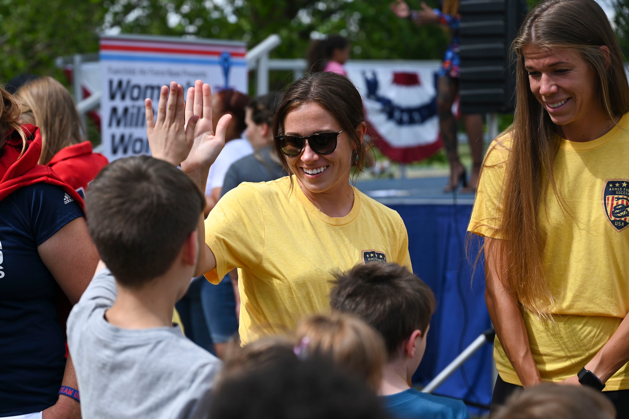 U.S. Air Force Capt. Kyele Bridel, T-6 Texan II instructor pilot and Capt. Morgan Roberts, 38th Force Support officer, meet and greet attendees at a pep rally, to kick-off the Women’s Military World Cup, at Fairchild Air Force Base, Wash., July 10, 2022. Bridel is one of six pilots on the team. (U.S. Air Force photo by Senior Airman Jessica Haynie)