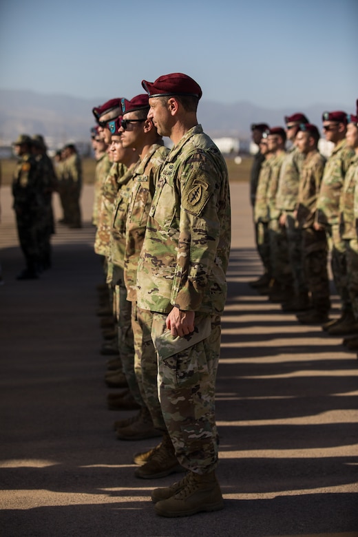 Soldiers stand in a formation.