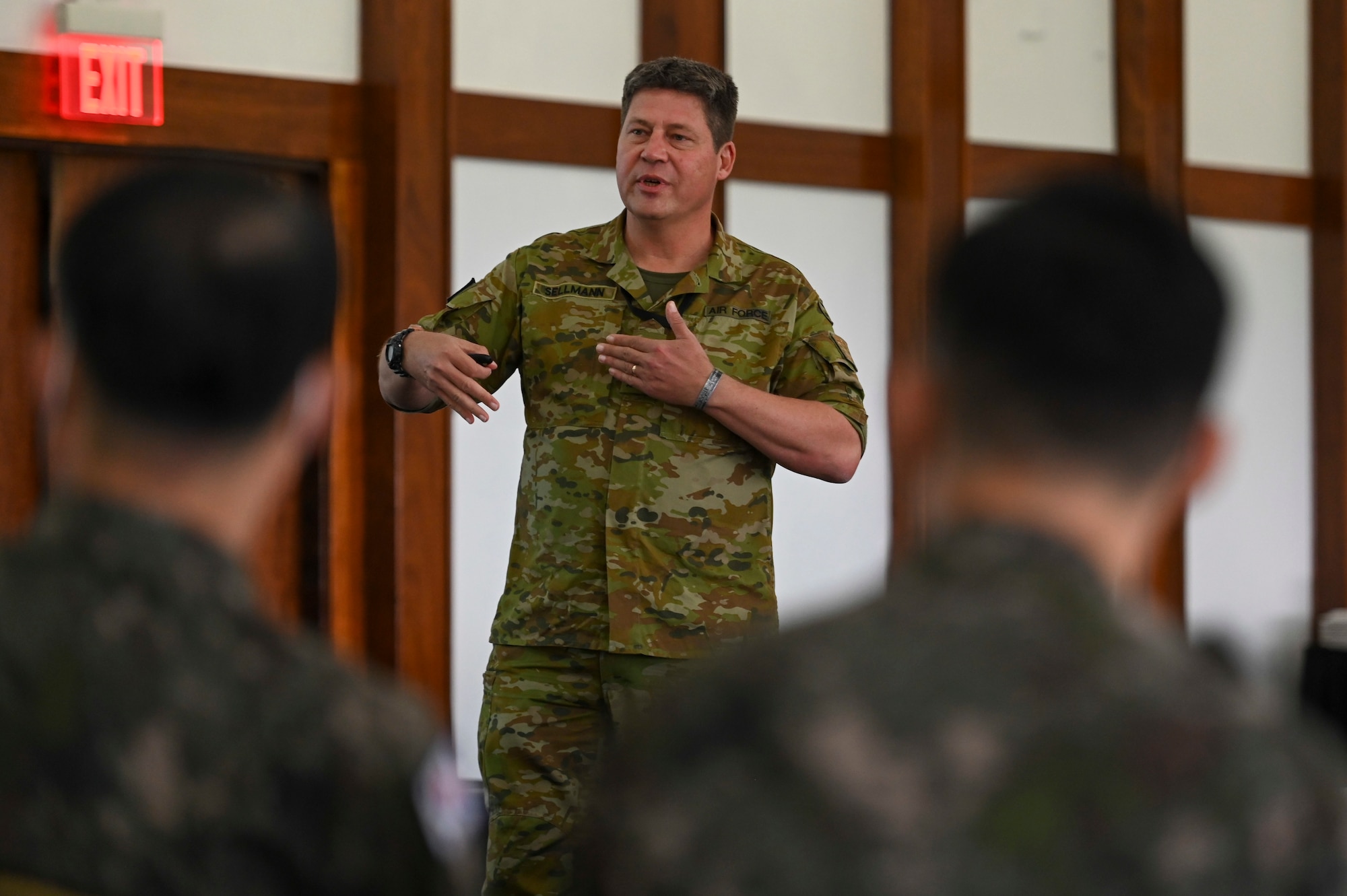 Wing Commander Michael Sellmann, a member of the Royal Australian Air Force, gives a briefing during the Pacific Unity Multi-Lateral Civil Engineer Key Leader Engagement, June 22, 2022 at Andersen Air Force Base, Guam. Senior military leaders from six Indo-Pacific nations gathered for the KLE to focus on multi-lateral efforts accelerating interoperability among their respective engineers. (U.S. Air Force Photo by Airman 1st Class Emily Saxton)