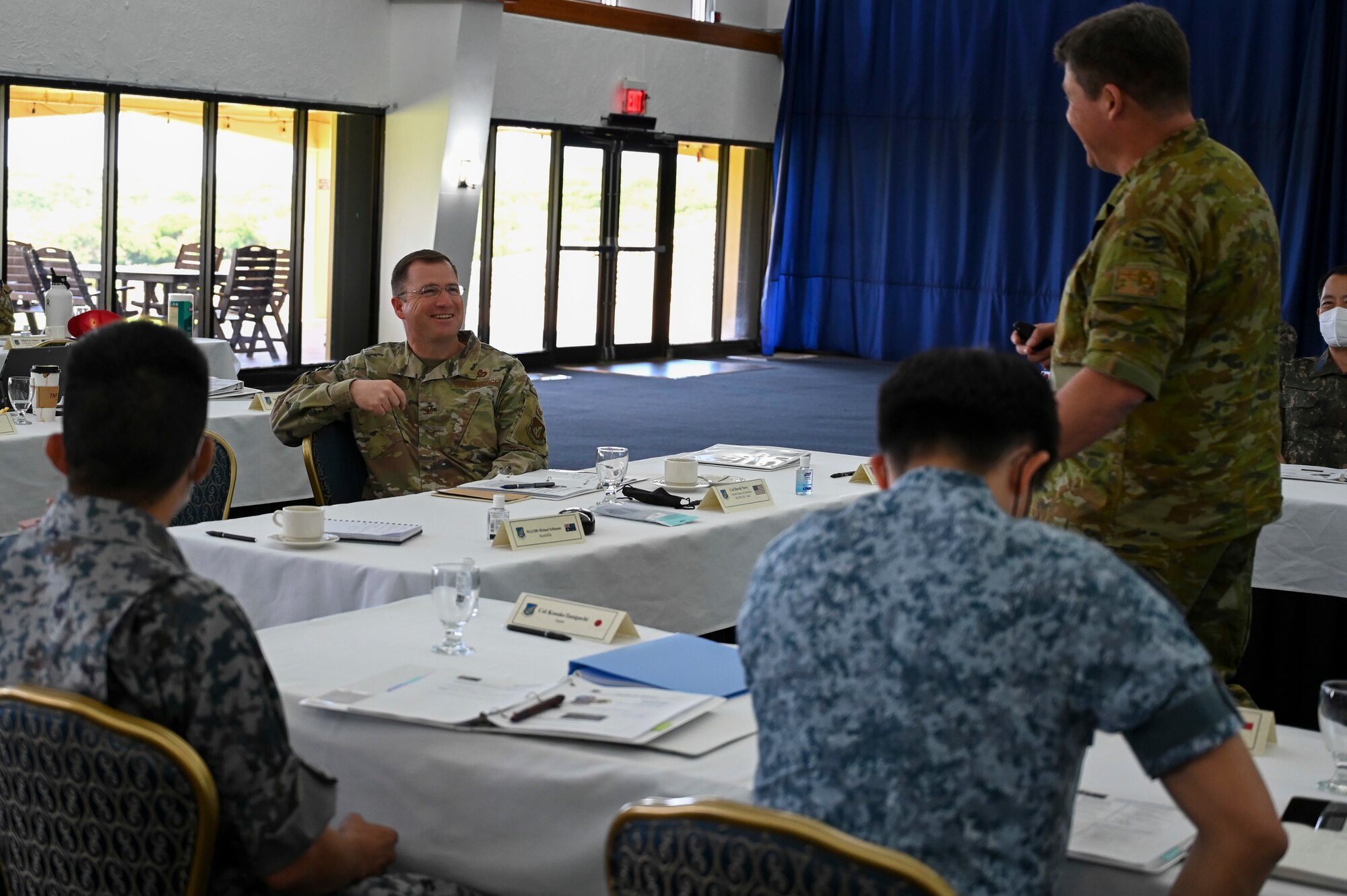 Members of the U.S. Air Force, Royal Australian Air Force, Republic of Singapore Air Force and the Japan Air Self-Defense Force attend the Pacific Unity Multi-Lateral Civil Engineer Key Leader Engagement, June 22, 2022 at Andersen Air Force Base, Guam. Senior military leaders from six Indo-Pacific nations gathered for the KLE to focus on multi-lateral efforts accelerating interoperability among their respective engineers. (U.S. Air Force Photo by Airman 1st Class Emily Saxton)