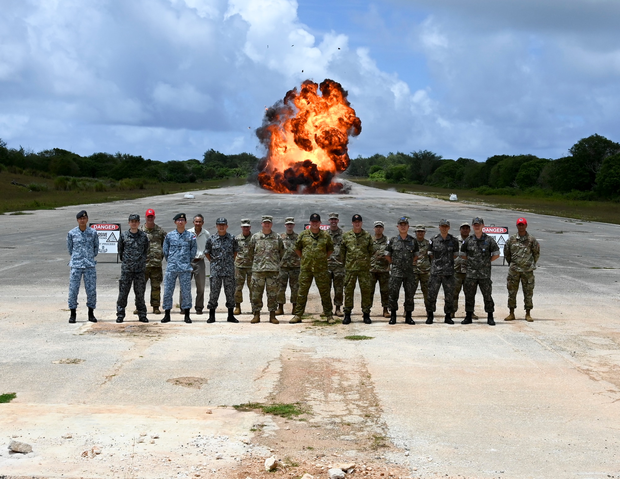 Members of the U.S. Air Force, Royal Australian Air Force, Japan Air Self-Defense Force, Republic of Korea Air Force and the Republic of Singapore Air Force pose for a photo during the Pacific Unity Multi-Lateral Civil Engineer Key Leader Engagement, June 23, 2022 at Andersen Air Force Base, Guam. Themes during this KLE included topics of shared interest across the allies and partners such as joint capabilities, leveraging expertise in the Total Force, and increased frequency of subject matter expert exchanges and multi-lateral training. (U.S. Air Force Photo by Airman 1st Class Emily Saxton)